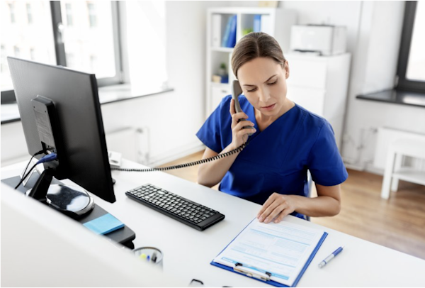 Healthcare professional handling insurance paperwork