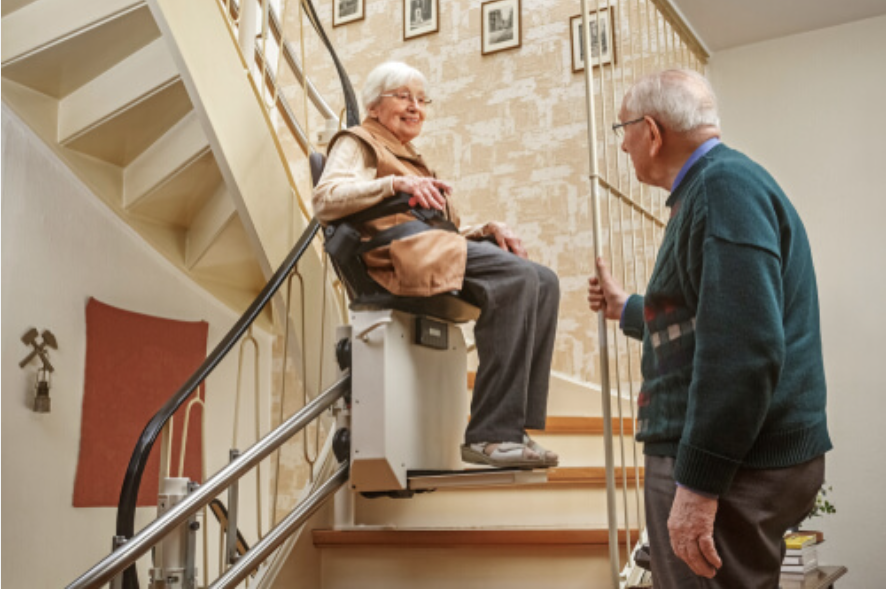 Elderly woman using stair lift